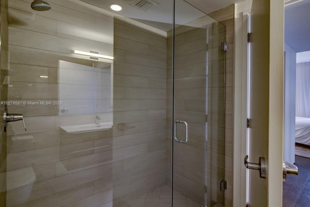 9940 W Bay Harbor Dr Unit 7G-N, Bay Harbor Islands, FL 33154 - bathroom featuring a stall shower and ensuite bathroom