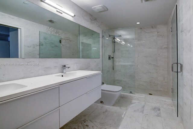 9940 W Bay Harbor Dr Unit 7G-N, Bay Harbor Islands, FL 33154 - bathroom with a shower stall, toilet, double vanity, tile walls, and recessed lighting