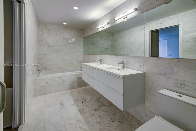 9940 W Bay Harbor Dr Unit 7G-N, Bay Harbor Islands, FL 33154 - full bath with toilet, a garden tub, tile walls, double vanity, and marble look tile flooring