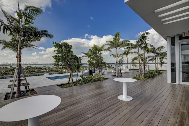 wooden terrace with a water view