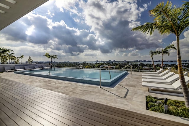 view of swimming pool with a deck