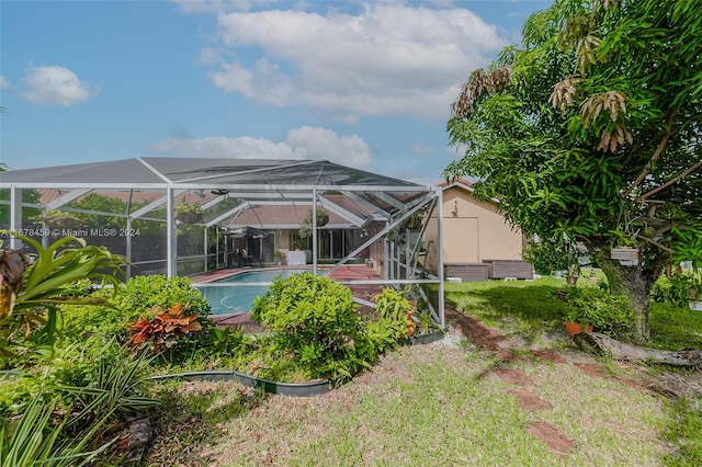 rear view of property featuring a patio and a lanai