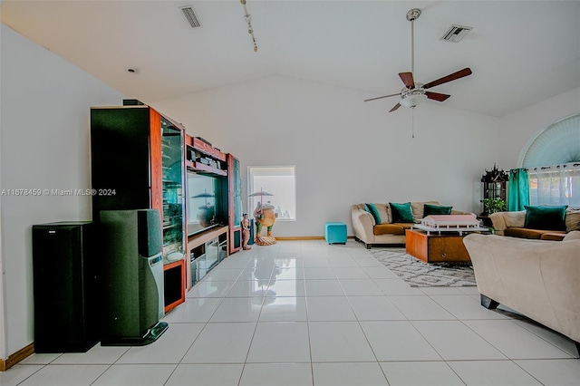 living room with a healthy amount of sunlight, ceiling fan, rail lighting, and light tile patterned floors