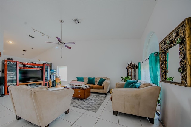 tiled living room with track lighting, high vaulted ceiling, and ceiling fan