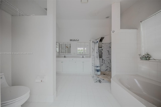 full bathroom featuring vanity, toilet, independent shower and bath, and tile patterned flooring