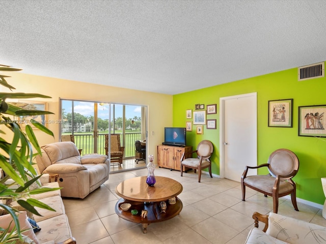 tiled living room with a textured ceiling