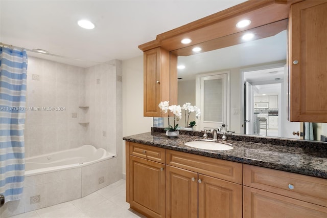 bathroom featuring vanity, shower / bath combo, and tile patterned floors