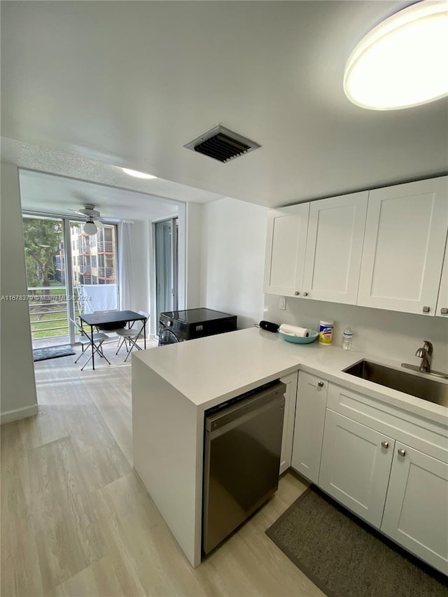 kitchen with dishwasher, white cabinets, sink, light hardwood / wood-style flooring, and ceiling fan