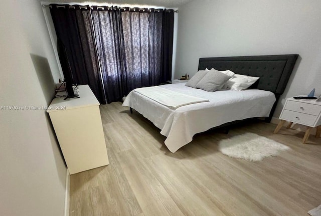 bedroom with light hardwood / wood-style flooring