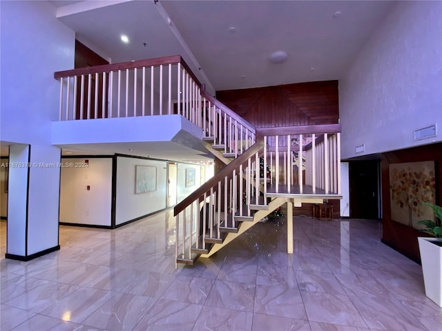 stairway with a high ceiling