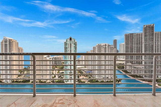 balcony featuring a water view