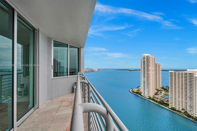 balcony featuring a water view