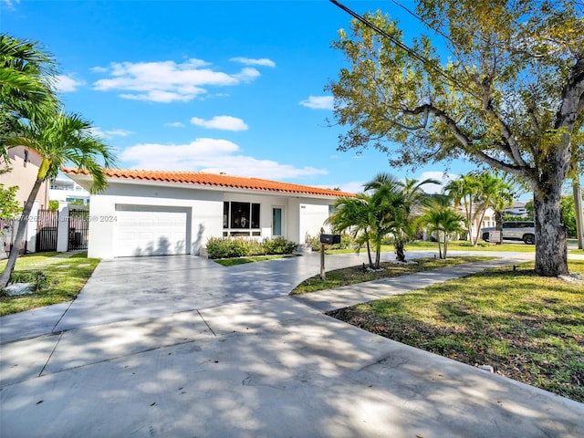 view of front facade with a front lawn and a garage