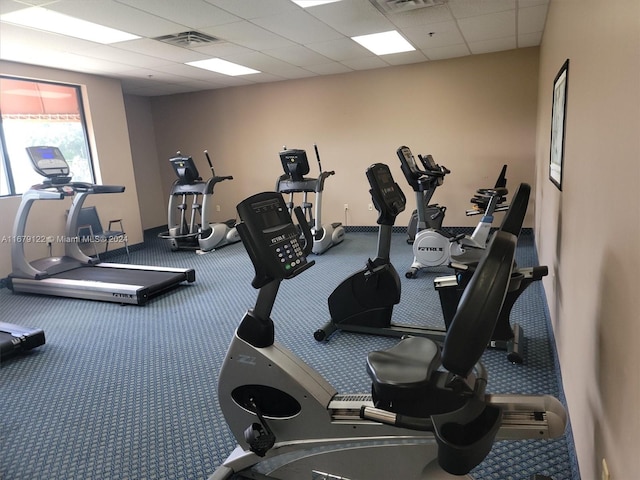 workout area featuring a drop ceiling