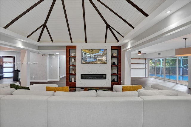 living room featuring ceiling fan, high vaulted ceiling, wood-type flooring, and a wealth of natural light