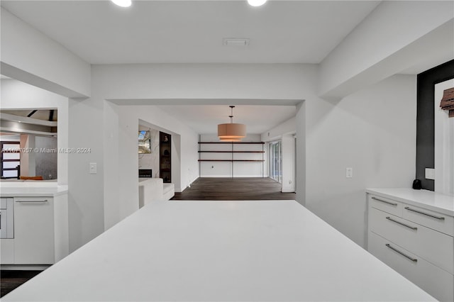 hallway featuring dark wood-type flooring