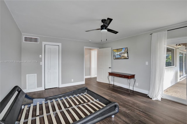 unfurnished bedroom featuring a closet, ceiling fan, and dark hardwood / wood-style flooring