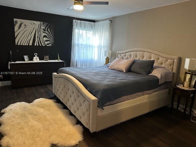 bedroom featuring wood finished floors and ceiling fan