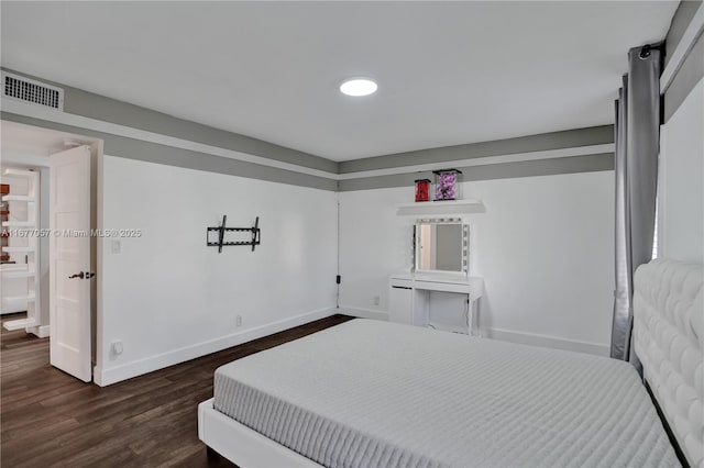 bedroom with visible vents, baseboards, and dark wood-style flooring