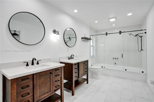 full bathroom featuring two vanities, marble finish floor, a sink, and recessed lighting