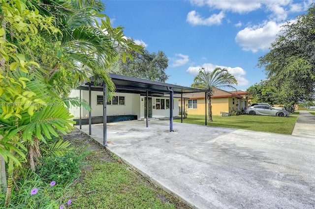 exterior space with a carport