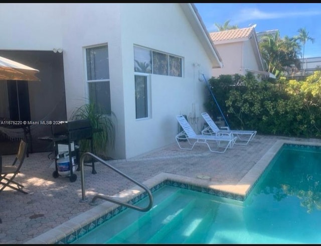 view of pool featuring a patio area