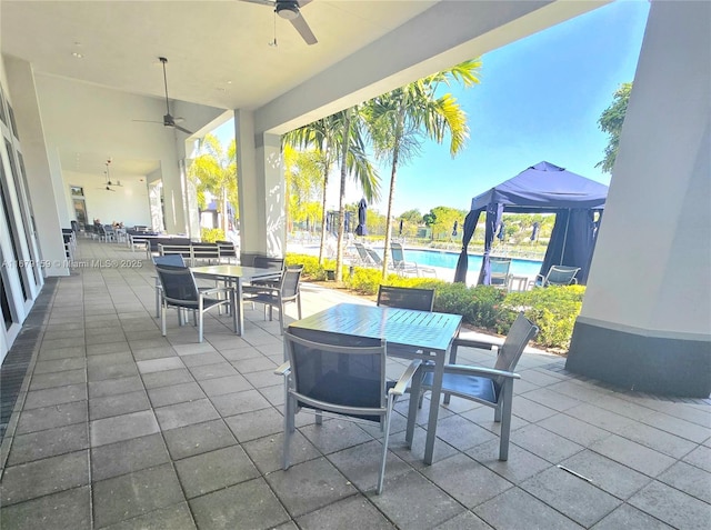 7612 Knight St, Parkland, FL 33067 - view of patio featuring outdoor dining area, a ceiling fan, and a community pool