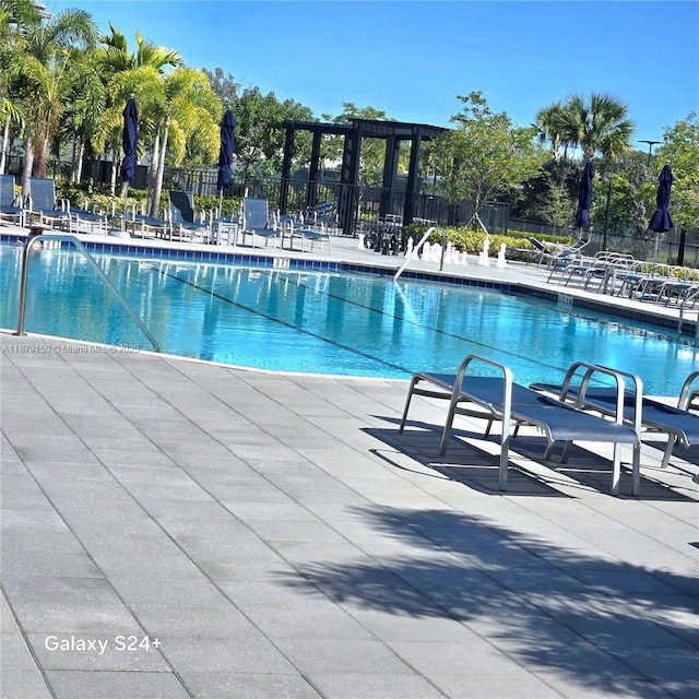 7612 Knight St, Parkland, FL 33067 - community pool featuring a patio area and fence