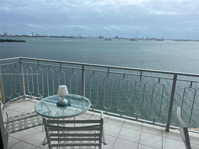 balcony featuring a water view