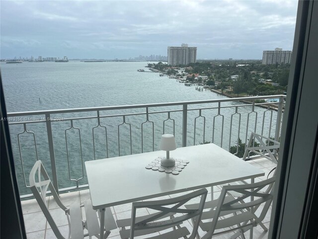 balcony featuring a water view