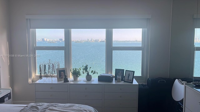 bedroom featuring a water view