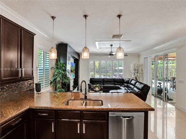 kitchen with stainless steel dishwasher, sink, and a healthy amount of sunlight