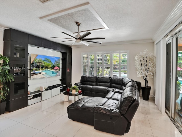 tiled living room with ornamental molding, a textured ceiling, and ceiling fan