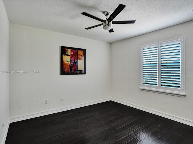 empty room with a textured ceiling, wood-type flooring, and ceiling fan