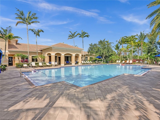 view of swimming pool featuring a patio area