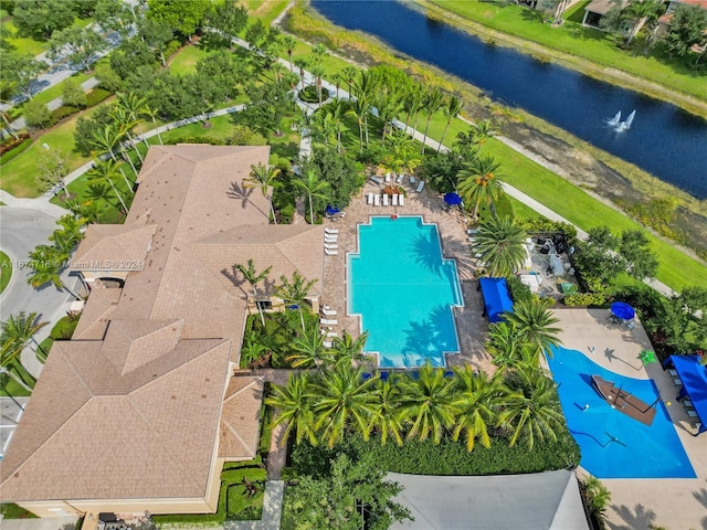 birds eye view of property with a water view