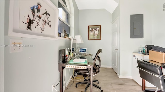 office featuring electric panel and light hardwood / wood-style floors