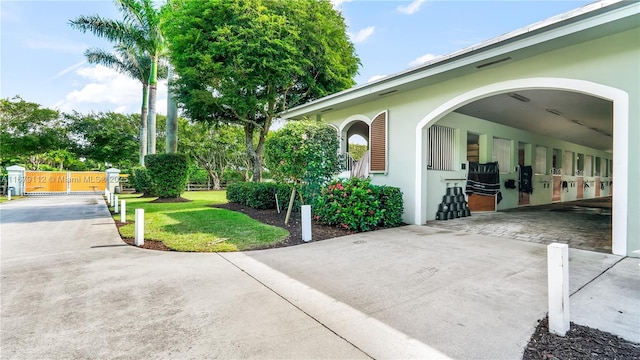 exterior space with a carport