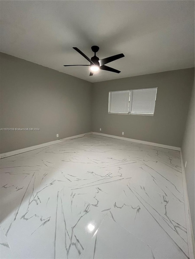 unfurnished room featuring ceiling fan