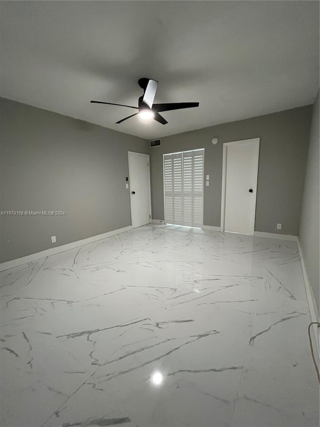 empty room featuring ceiling fan