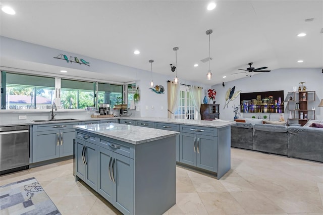 kitchen with sink, dishwasher, a center island, vaulted ceiling, and pendant lighting