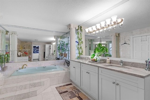 bathroom with tile patterned floors, separate shower and tub, plenty of natural light, vanity, and a textured ceiling