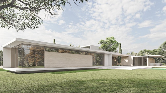 rear view of house featuring a lawn and a swimming pool