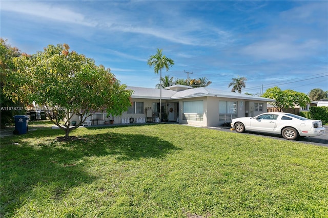 ranch-style home with a front yard