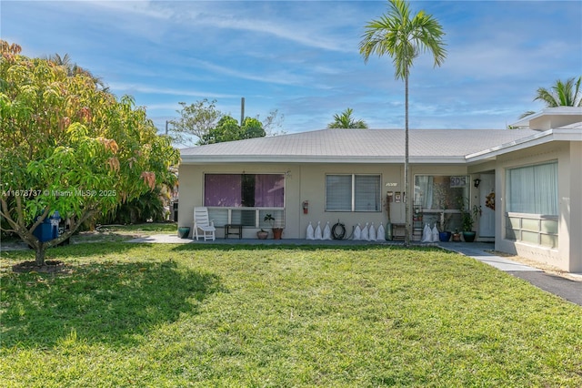 single story home featuring a front yard