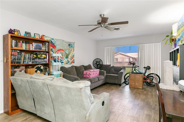 living room with ceiling fan and light hardwood / wood-style floors