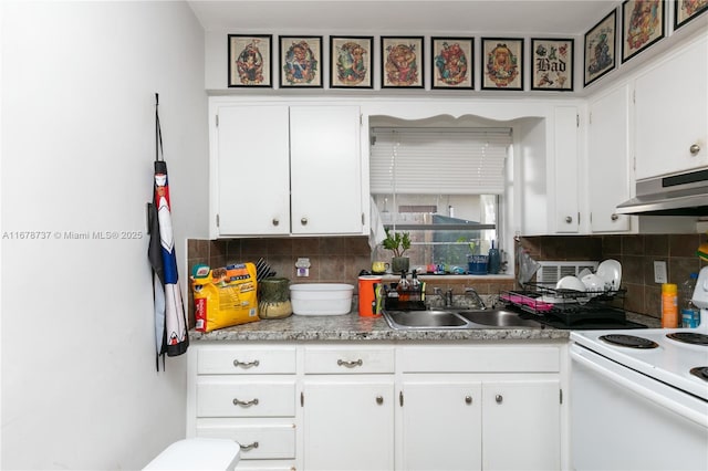 kitchen featuring white electric stove, white cabinets, backsplash, and sink