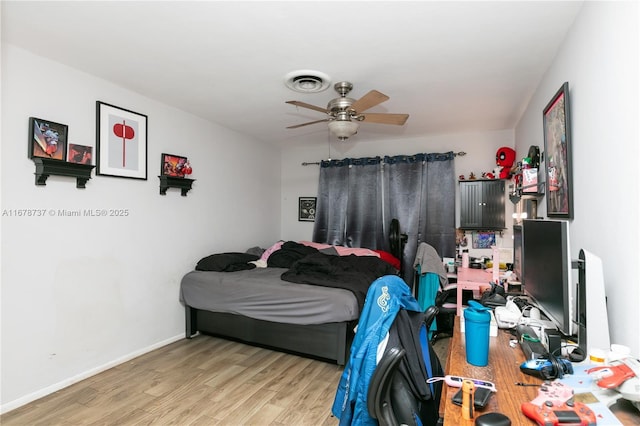 bedroom featuring ceiling fan and light hardwood / wood-style flooring