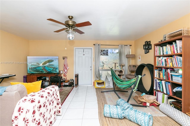 living room featuring ceiling fan and light tile patterned flooring