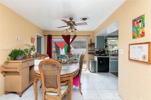 tiled dining area featuring ceiling fan